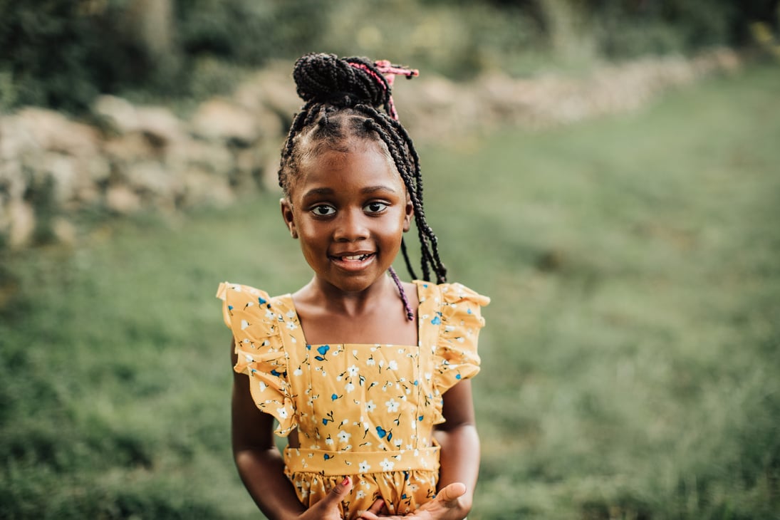 Portrait of Smiling Child Outdoors 